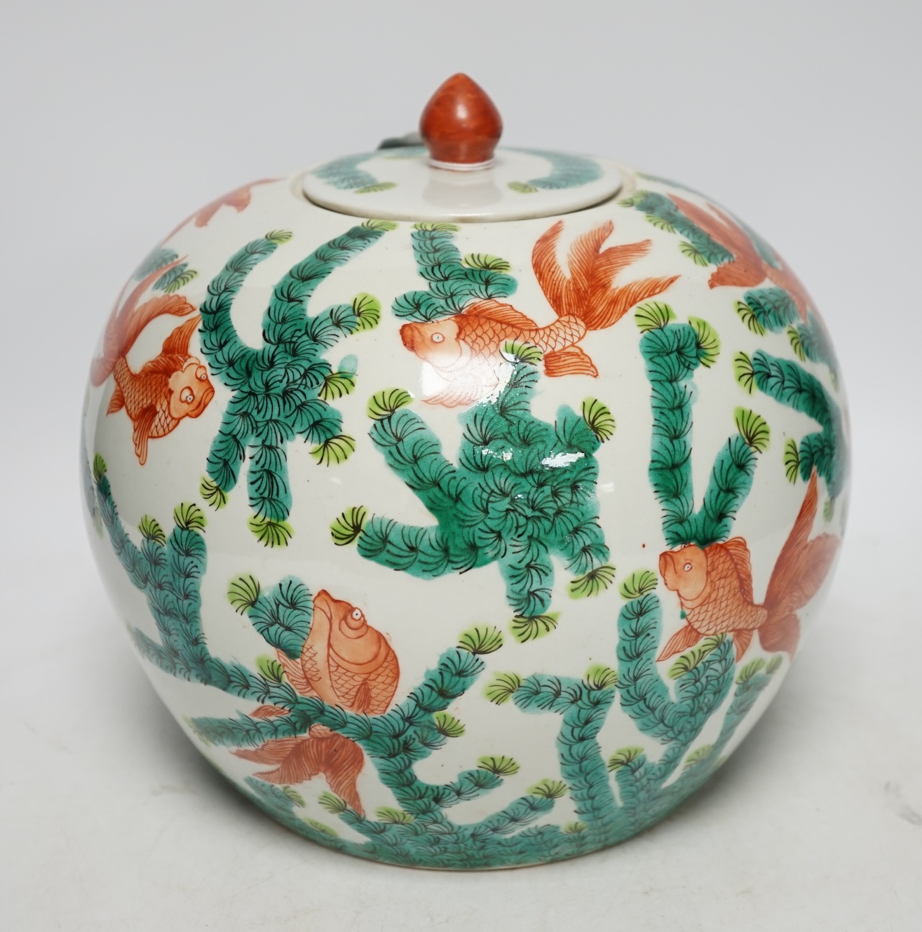 From the Studio of Fred Cuming. A Chinese famille verte goldfish jar and cover, 23cm high. Condition - good